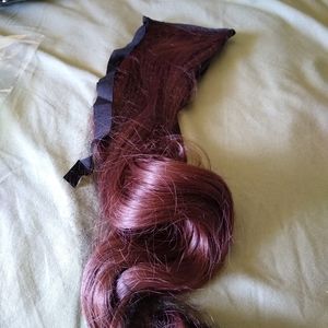 Drawstring ponytail. Reddish/Brown color.